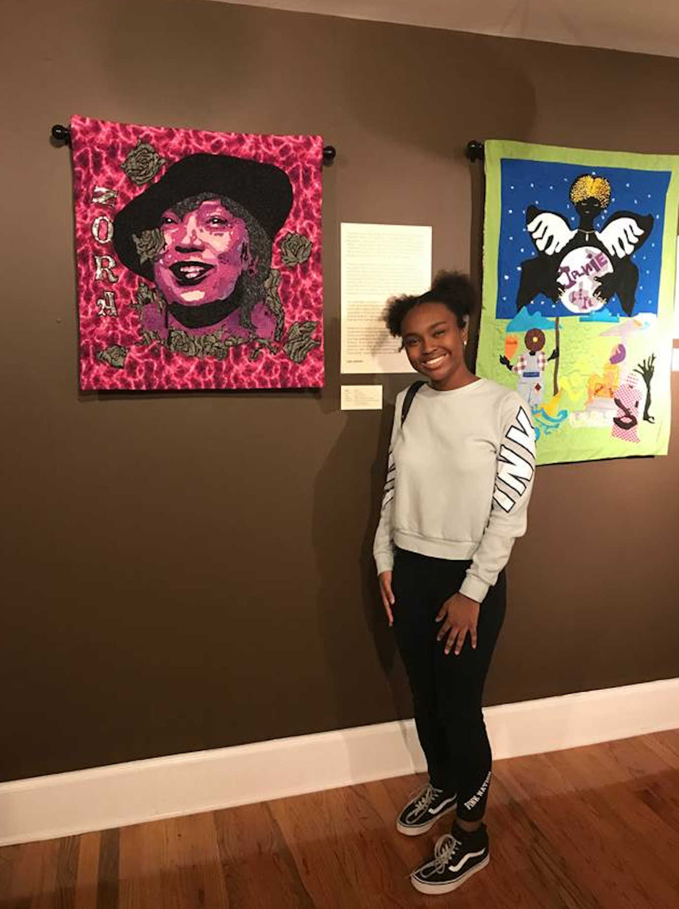 A Tuskegee student visiting &ldquo;The Soul of Zora: A Literacy Legacy through Quilts&rdquo; at The Legacy Museum. Image courtesy of Tuskegee University.