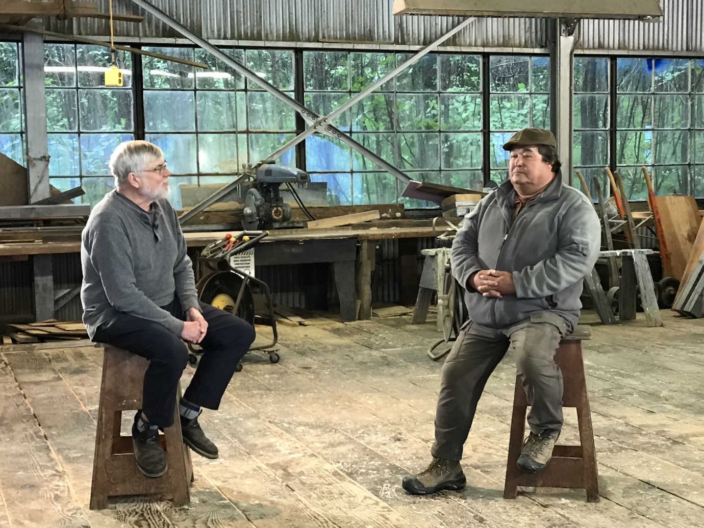 Project Historian Bob King interviews former spring/fall cannery crewmember Bruce Anderson in the Diamond NN Cannery&rsquo;s Carpenter Shop in July 2019. Image courtesy of the NN Cannery History Project.