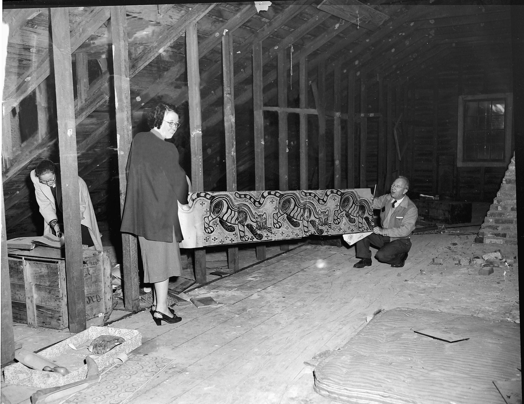 Ray Thompson and Ruthe M. Carr hold a Walter Anderson print in the unfinshed attic at Oldfields House, a National Historic Site in Mississippi. Originally published in Down South Magazine, this photograph was one of the many saved with the assistance of NEH grants. Image courtesy of Mississippi Gulf Coast Community College C.C. &ldquo;Tex&rdquo; Hamill Down South Magazine Collection.