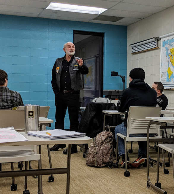 DePaul University Professor and Vietnam War veteran James Brask speaks at a public Veterans Day event about both &ldquo;The Value of the Veteran Voice&rdquo; and the importance of a civilian audience to hear and respond. Photo courtesy of Mark Waters.